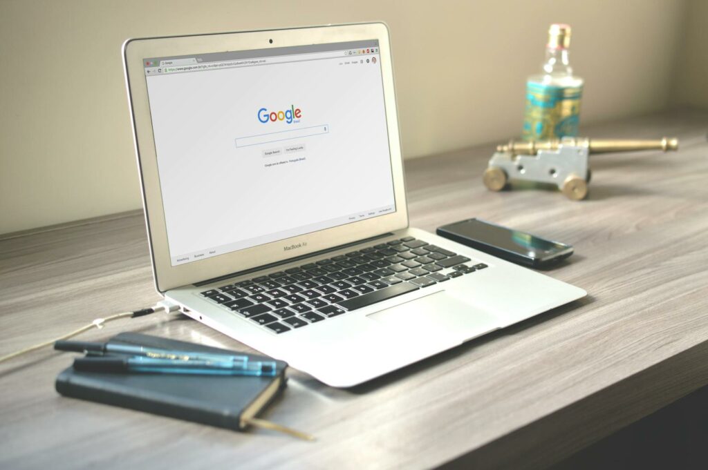 Macbook Air on Grey Wooden Table